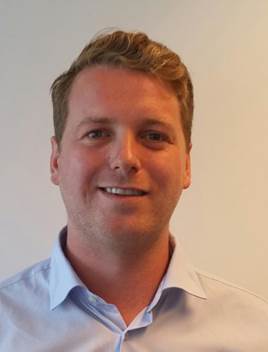 A person smiling for the camera
Description automatically generated with medium confidence